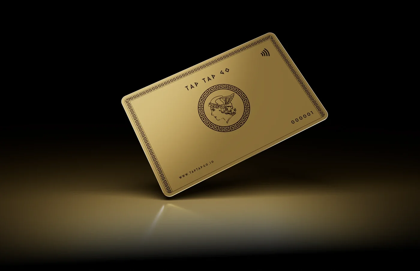 Tap Tap Go gold-finished card against a studio background